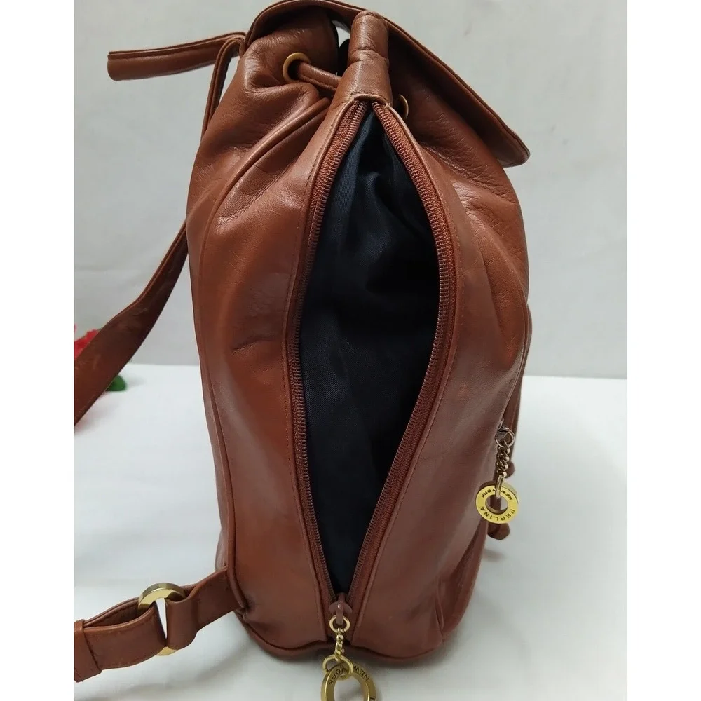 Perlina Brown Leather Zipper Pockets Flap Top Handle Drawstring Backpack